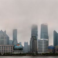 the Shanghai skyline shrouded in smog