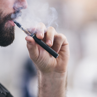 young man vaping