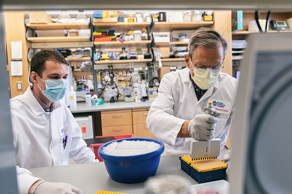 Timothy Springer (right), one of the 2022 Lasker Basic Medical Research awardees, works in the lab with a colleague at the Boston Children's Hospital.