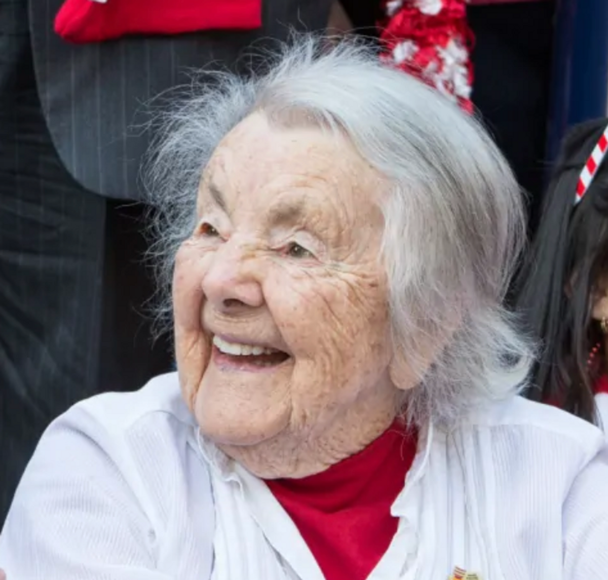 Woman smiling, looking away from camera