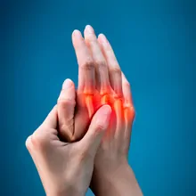 One hand holding the other, depicting pain in the joints One hand holding the other, depicting pain in the joints