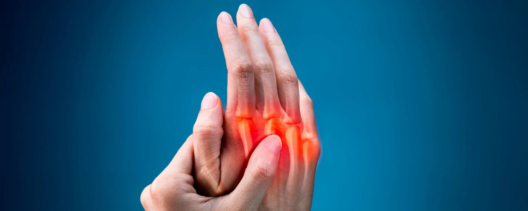 One hand holding the other, depicting pain in the joints One hand holding the other, depicting pain in the joints