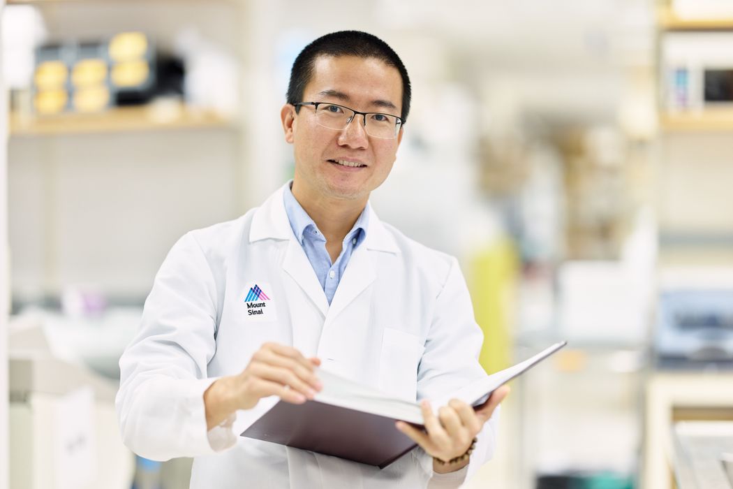 Headshot of Gang Fang, a geneticist at the Icahn School of Medicine at Mount Sinai, holding a book. Headshot of Gang Fang, a geneticist at the Icahn School of Medicine at Mount Sinai, holding a book.