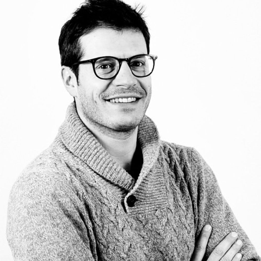 Grayscale photo of Julien Valton. Valton has dark hair and glasses and is wearing a sweater. Grayscale photo of Julien Valton. Valton has dark hair and glasses and is wearing a sweater.