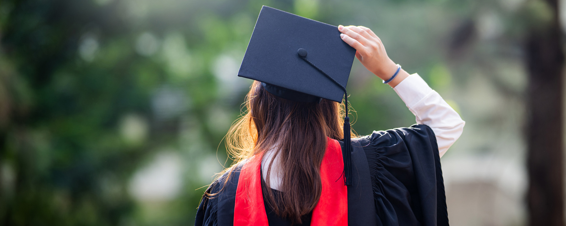 Graduate student in cap and gown