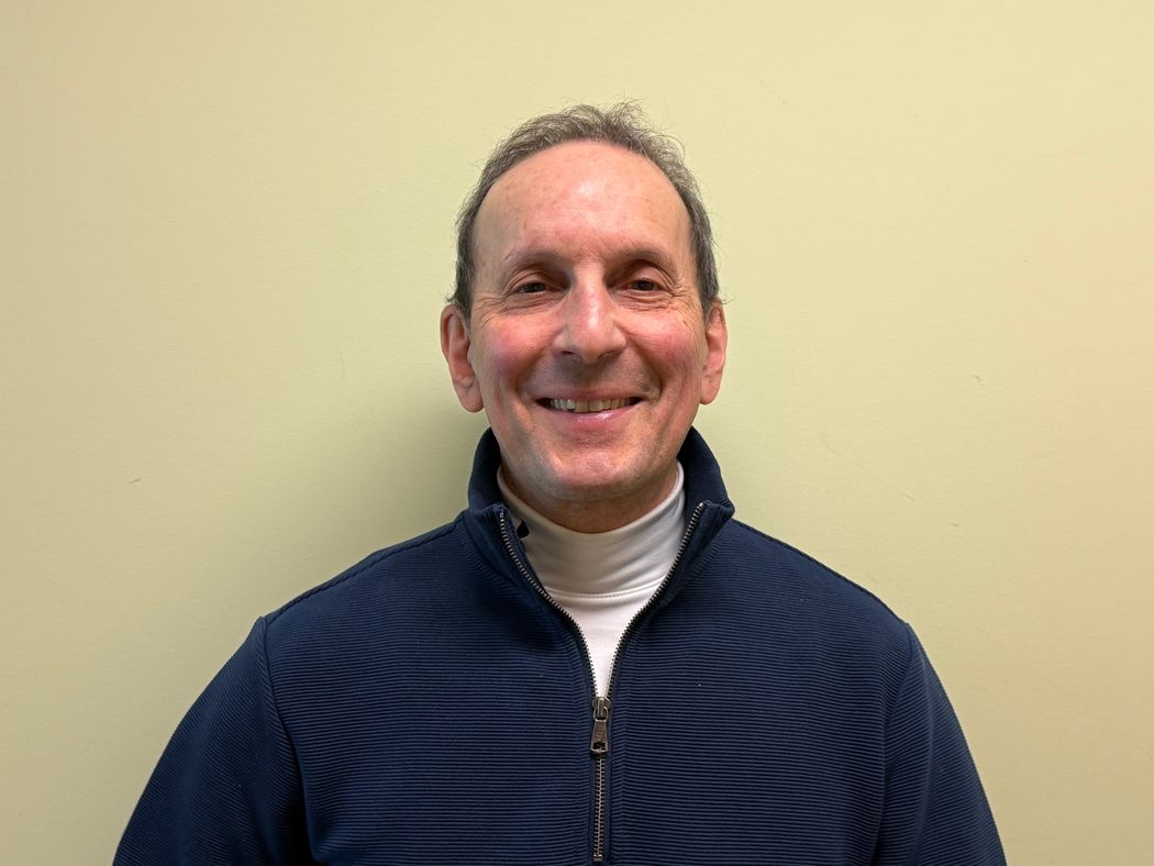 Image of Breakthrough Prize laureate, endocrinologist Daniel Drucker, against a yellow background. He wears a navy-blue jacket and smiles. Image of Breakthrough Prize laureate, endocrinologist Daniel Drucker, against a yellow background. He wears a navy-blue jacket and smiles.