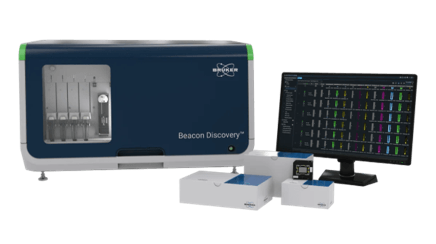 Imagem do sistema funcional de análise de células únicas, mostrando a plataforma de descoberta de beacon da Bruker Cellular Análise, um monitor de computador e caixas de produtos.