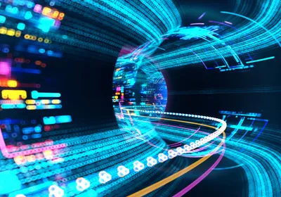 A tunnel formed by rainbow colored lights indicating speed and acceleration forward.