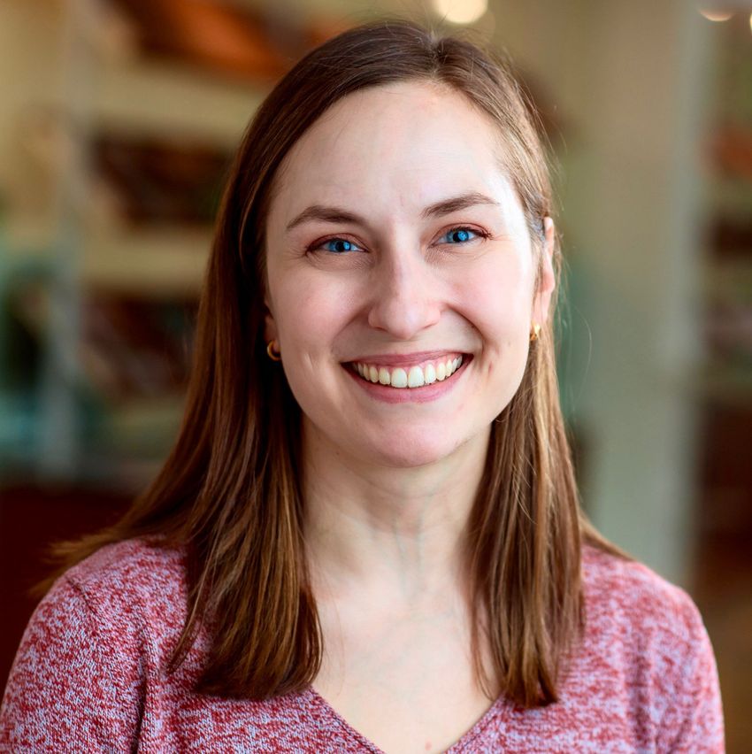 Photograph of Kathryn Yost, today a postdoctoral researcher at the Whitehead Institute. She has blue eyes and shoulder-length brown hair and is wearing a red knit shirt, smiling at the camera. Photograph of Kathryn Yost, today a postdoctoral researcher at the Whitehead Institute. She has blue eyes and shoulder-length brown hair and is wearing a red knit shirt, smiling at the camera.