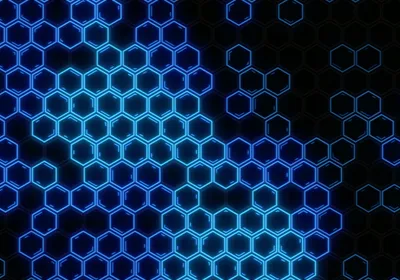 An image of a glowing hexagonal pattern on a dark background.