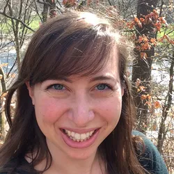 Photograph of Stephanie DeMarco. She has brown hair and blue eyes and is smiling at the camera. 