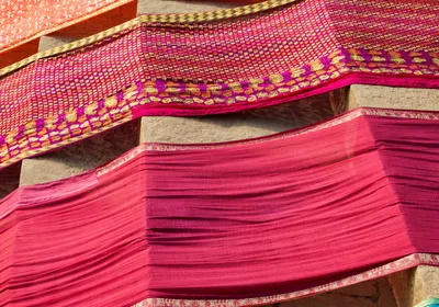 Drying cloths dyed with a red pigment.