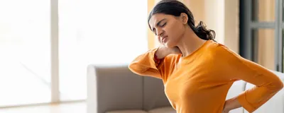 A young woman with neck and back pain.