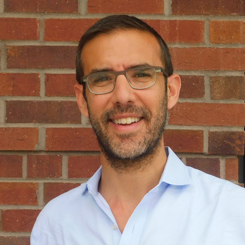 Image of Joshua Weitz in front of a brick wall. Image of Joshua Weitz in front of a brick wall.