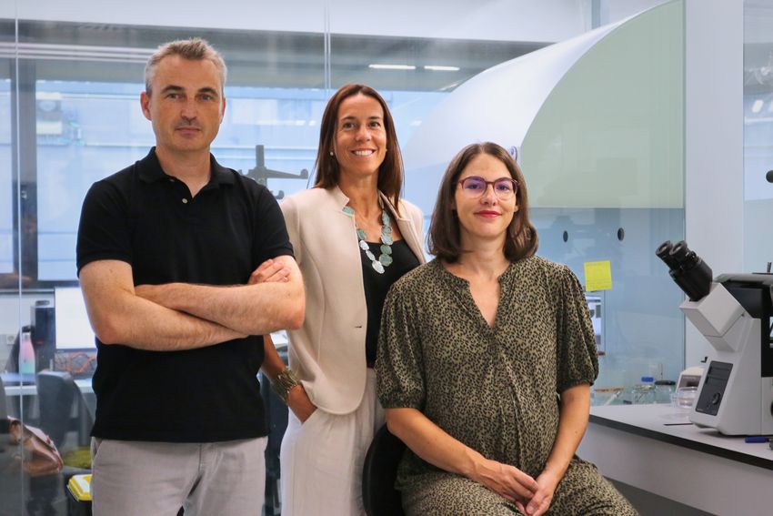 Study authors Samuel Ojosnegros (left; he wore black polo and light grey pants with his arms crossed), Anna Seriola (middle; she wore a beige jacket over a black top, white pants, blue necklace, and bracelet), and Amélie Godeau (right; she’s seated and wearing a green patterned dress).