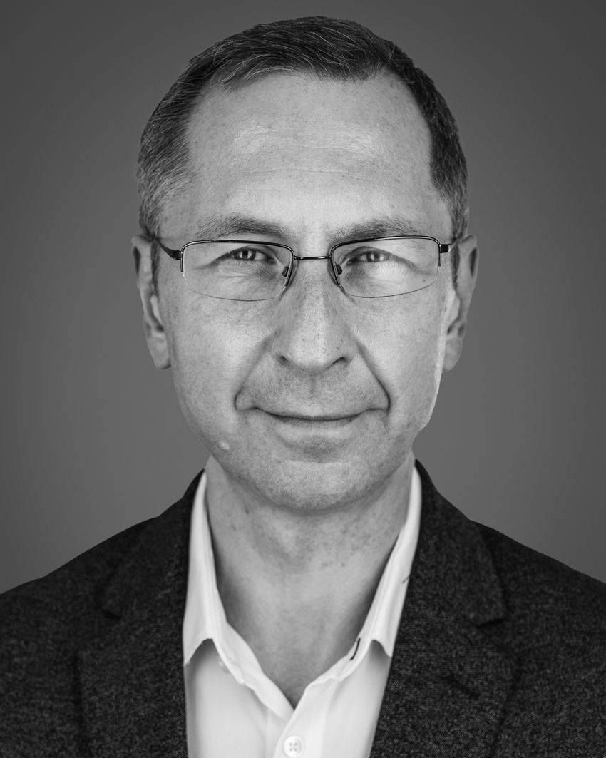 Black-and-white image of Fyodor Urnov, who’s wearing glasses and a dark textured suit over a light shirt. Black-and-white image of Fyodor Urnov, who’s wearing glasses and a dark textured suit over a light shirt.