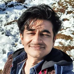 Anirban Mukhopadhyay wears a jacket against a snowy background. Anirban Mukhopadhyay wears a jacket against a snowy background.