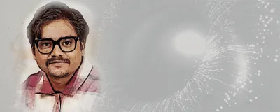 Souvik Ghosh, a postdoc at SUNY Upstate Medical University, wears a red shirt and smiles at the camera.