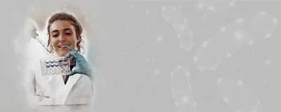 Marta Reguera Gomez, a postdoc at the University of Florida, holding a pipette in one hand and a multi-well plate in the other.