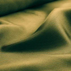 Conceptual background image of rippling gold material.