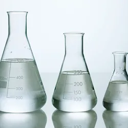 A photo of three water-filled flasks arranged by size. 