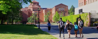 A photo of UCLA campus with students. With recent funding cuts targeting UCLA, researchers are worried about students’ futures. 