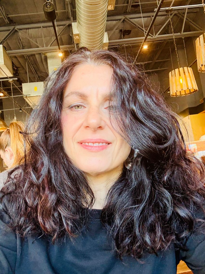 A picture of Maria Pia Miglietta wearing a black top. A picture of Maria Pia Miglietta wearing a black top.