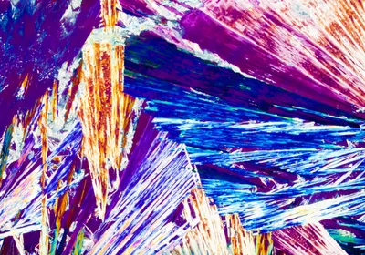 Polarized light shines through a crystal with a particular chirality. Polarized light shines through a crystal with a particular chirality.