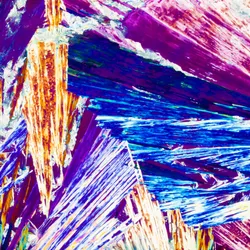 Polarized light shines through a crystal with a particular chirality. Polarized light shines through a crystal with a particular chirality.