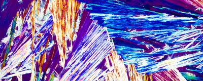 Polarized light shines through a crystal with a particular chirality.