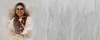 Mukta Sharma, a postdoctoral researcher at Michigan State University, against a background of corn crop.