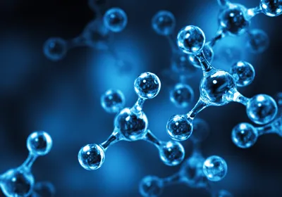 An abstract illustration of clear molecules in front of a dark blue background.