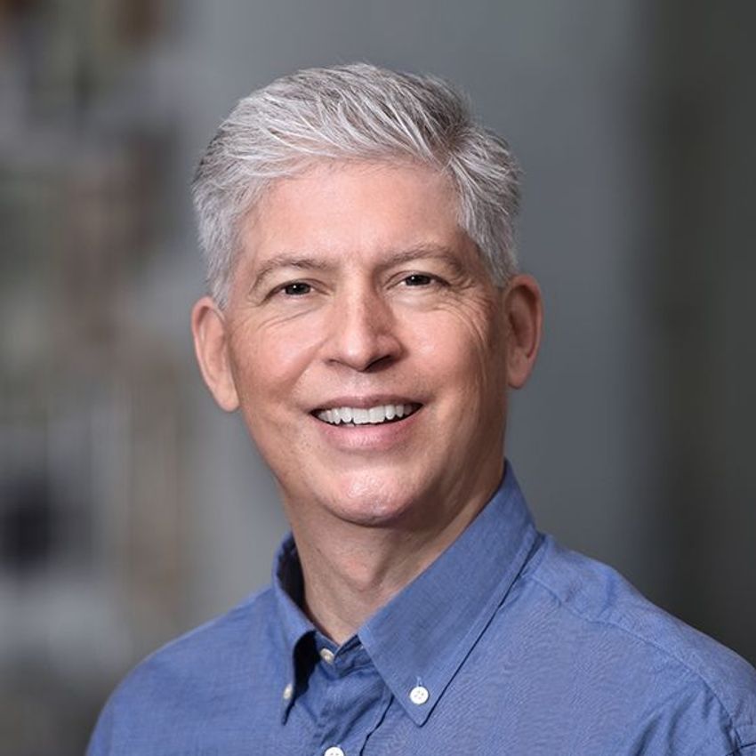 Photograph of Paul Ling, who helped develop an mRNA vaccine against EEHV, wearing a blue shirt.