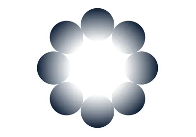 Illustration of a ring of circles drawn so that their outer edges are darker blue-black than their inner sides. This creates an optical illusion that the space in the center is a brighter white than the white background outside the circle ring. Illustration of a ring of circles drawn so that their outer edges are darker blue-black than their inner sides. This creates an optical illusion that the space in the center is a brighter white than the white background outside the circle ring.