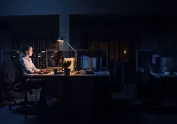 A person working late at night in the office. Night shift workers are more prone to falling sick due to disruptions in their circadian rhythms. A person working late at night in the office. Night shift workers are more prone to falling sick due to disruptions in their circadian rhythms.