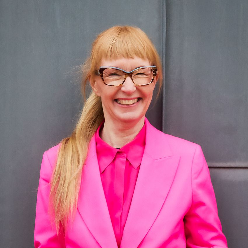 Pharmaceutical scientist Lotte Bjerre Knudsen smiles wearing a pink shirt, a blazer, and glasses. Pharmaceutical scientist Lotte Bjerre Knudsen smiles wearing a pink shirt, a blazer, and glasses.