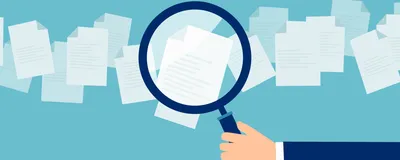 A magnifying glass held against paper illustrates the academic peer review process.