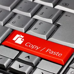 A keyboard with a “Copy/Paste” key in red, indicating image duplication issues that plague some research fields, such as animal models of a type of stroke called subarachnoid hemorrhage. 