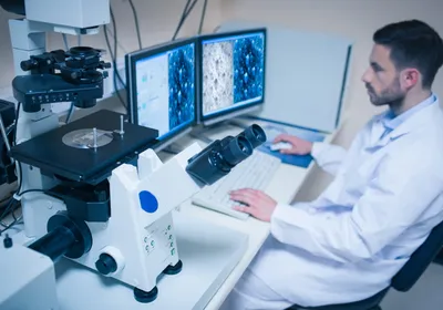 A scientist analyzing a specimen under an electron microscope, carefully observing the intricate molecular structures. A scientist analyzing a specimen under an electron microscope, carefully observing the intricate molecular structures.
