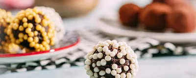 Image of a sugar-coated chocolate truffle on a table.