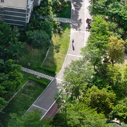 Image of green space outside of an apartment building.