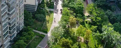 Image of green space outside of an apartment building. Image of green space outside of an apartment building.