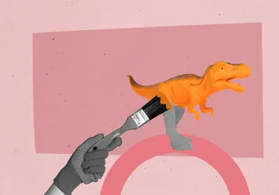 A paintbrush with orange paint colors a grey dinosaur on a pink background, representing researchers’ efforts to reconstruct dinosaur colors in the past decade.