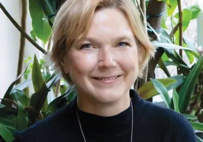 Photograph of bioengineer Linda Griffith, who develops endometrial organoids, wearing a black top.