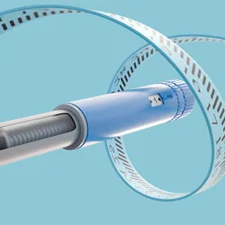 Measuring tape circulates around a GLP-1 drug injector pen, representing the drug’s dramatic effects on weight loss. Measuring tape circulates around a GLP-1 drug injector pen, representing the drug’s dramatic effects on weight loss.