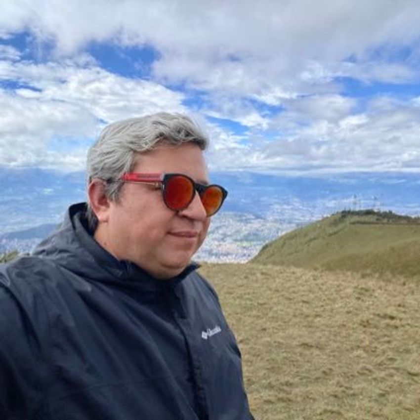 Photograph of Ranier Gutierrez, a neuroscientist who studies how the brain encodes and responds to tastes, wearing a jacket and sunglasses against a natural background.