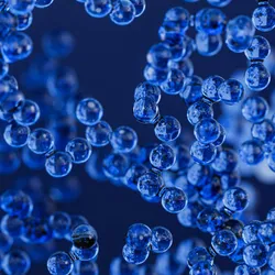 An illustration of small blue spheres representing electric field-controlled nanoparticles clustered together.