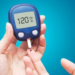 person doing the finger prick test for measuring blood glucose. A new noninvasive method could provide an alternative to such invasive blood tests.