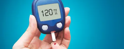 person doing the finger prick test for measuring blood glucose. A new noninvasive method could provide an alternative to such invasive blood tests.