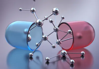 Open capsule or pill with molecular structure. 